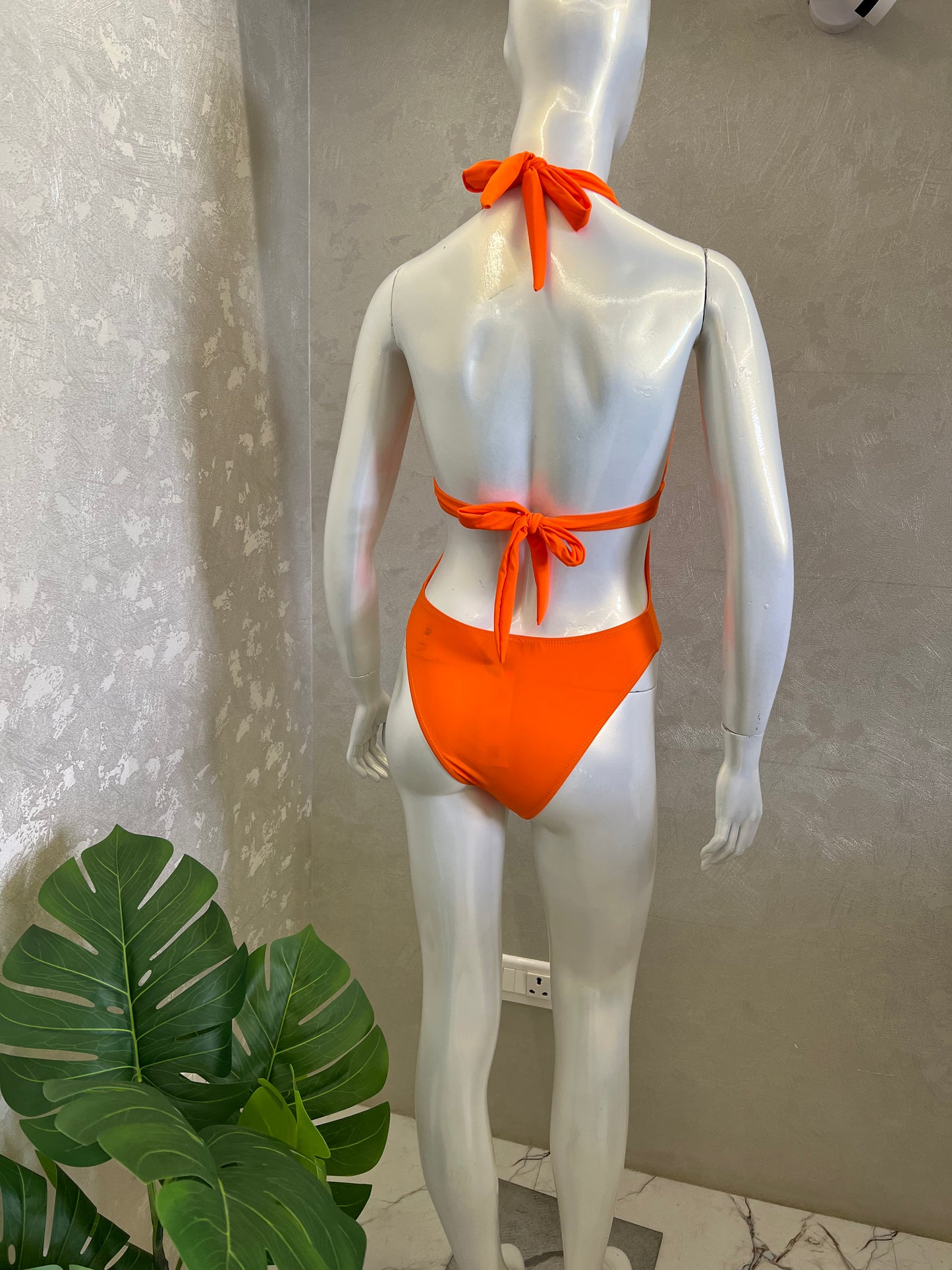 HALTER SWIMSUIT WITH METAL EMBELLISHMENT